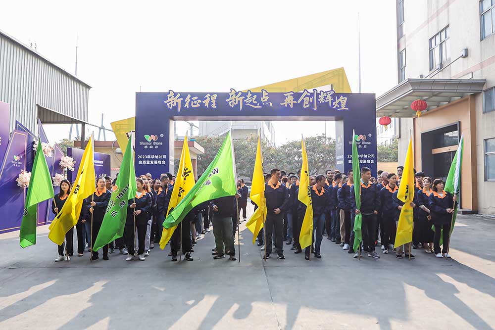 All sales team members taking a group photo at the office entrance during a meeting
